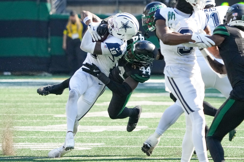 Dallas Cowboys wide receiver Ryan Flournoy (19) being tackled by New York Jets linebacker Jamien Sherwood (44).