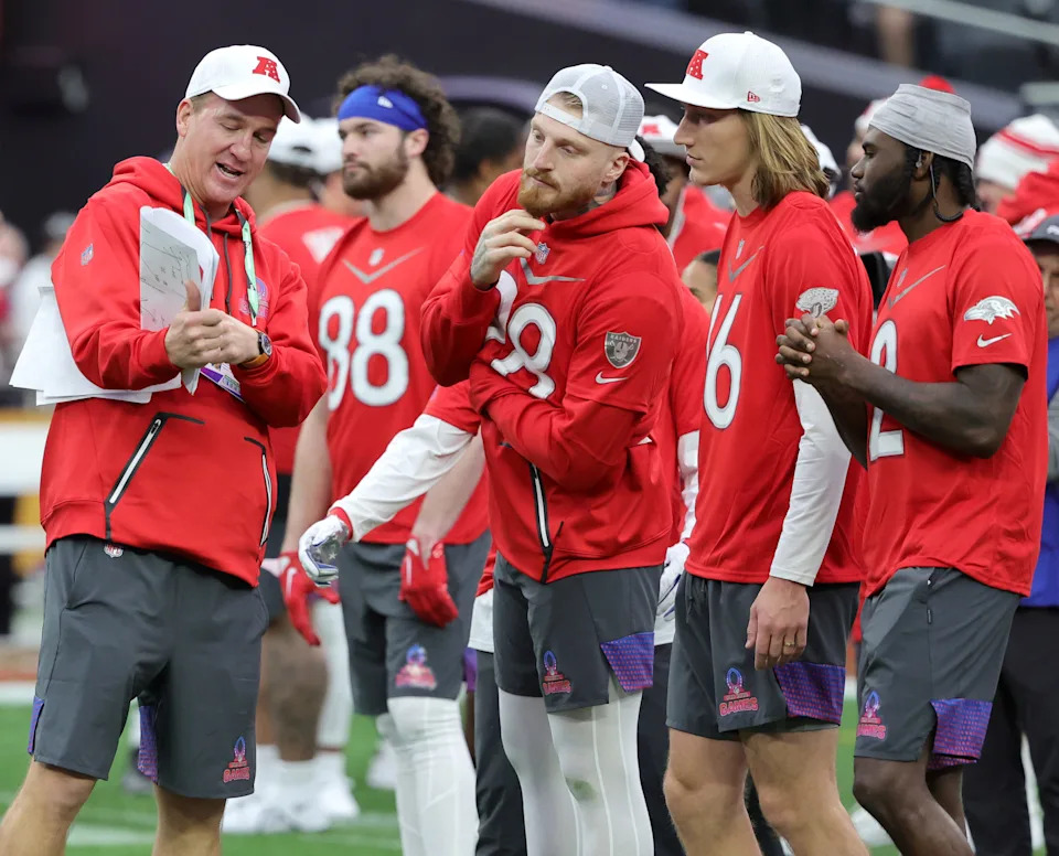 AFC head coach Peyton Manning talks with AFC players Maxx Crosby #98 of the Las Vegas Raiders, Trevor Lawrence #16 of the Jacksonville Jaguars and Tyler Huntley #2 of the Baltimore Ravens during the 2023 NFL Pro Bowl Games at Allegiant Stadium on February 05, 2023 in Las Vegas, Nevada.