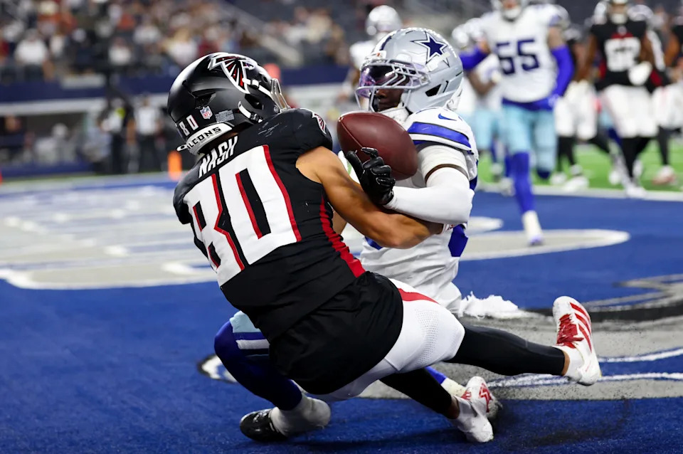 Aug 22, 2025; Arlington, Texas, USA; Dallas Cowboys cornerback Robert Rochell (30) and Atlanta Falcons wide receiver Nick Nash (80) go for the ball during the fourth quarter at AT&T Stadium. Mandatory Credit: Kevin Jairaj-Imagn Images