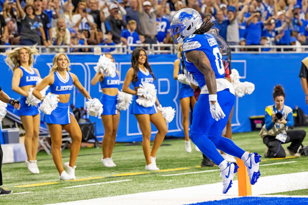 Detroit Lions running back Jahmyr Gibbs (0) celebrates a touchdown.