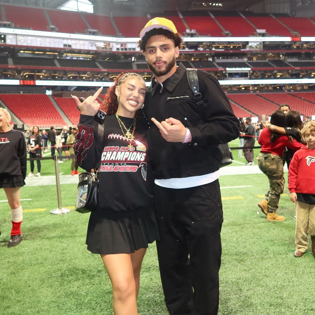 Drake and Makayla London pose for a photo on the field after an Atlanta Falcons home game, shared on Instagram