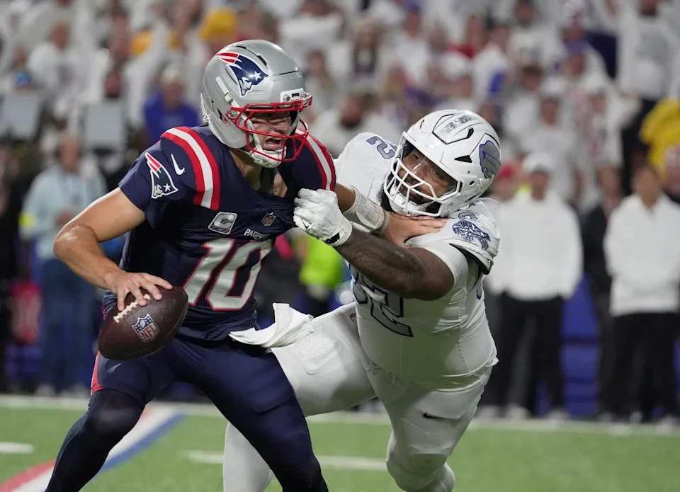 Buffalo Bills defensive tackle Daquan Jones tries to sack New England Patriots quarterback Drake Maye but May was able to get throw the ball for a completion during second half action at Highmark Stadium in Orchard Park on Oct. 5, 2025.
