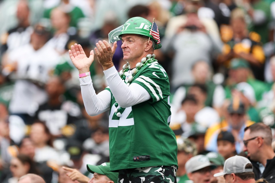 New York Jets fan cheering at a game.
