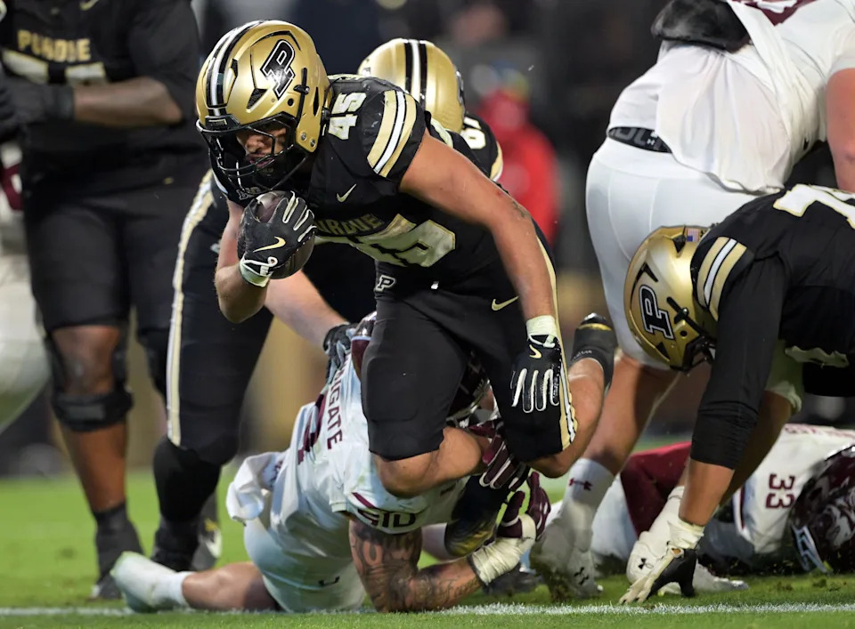 Sep 6, 2025; West Lafayette, Indiana, USA; Purdue Boilermakers running back Devin Mockobee (45) jumps into the end zone for a touchdown during the second half against the Southern Illinois Salukis at Ross-Ade Stadium. Mandatory Credit: Marc Lebryk-Imagn Images