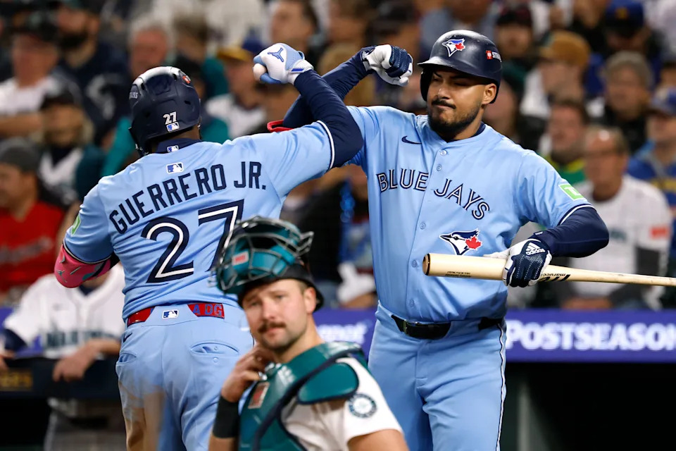 Vladdy celebrates after hitting a homer in Game 3. (Alika Jenner/Getty Images)