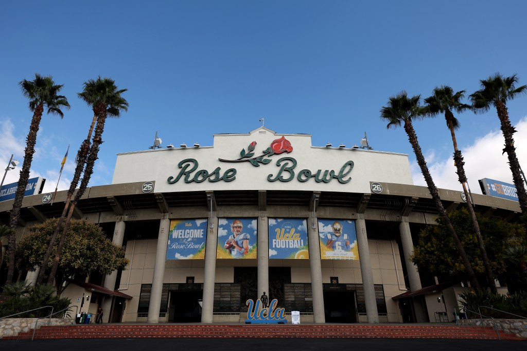 Exterior view of the Rose Bowl Stadium with "Rose Bowl" sign and "Welcome to the Rose Bowl" banners for UCLA football.