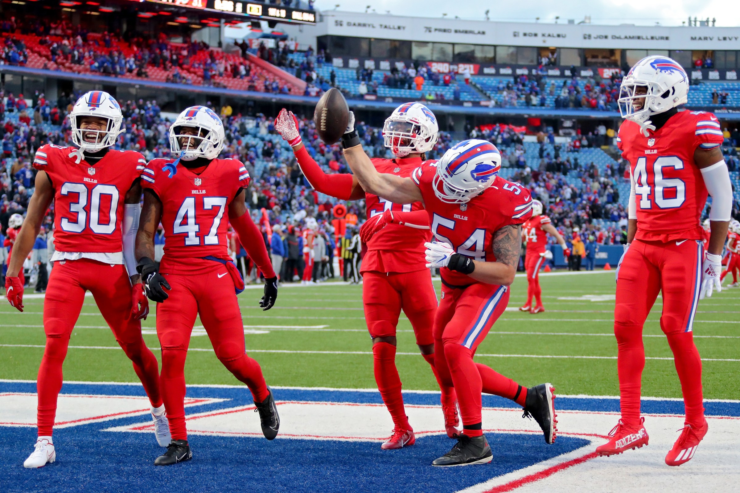 ORCHARD PARK, NEW YORK - DECEMBER 19: A.J. Klein #54 of the Buffalo Bills and teammates celebrate an interception in the fourth quarter of the game against the Carolina Panthers at Highmark Stadium on December 19, 2021 in Orchard Park, New York. (Photo by Timothy T Ludwig/Getty Images)