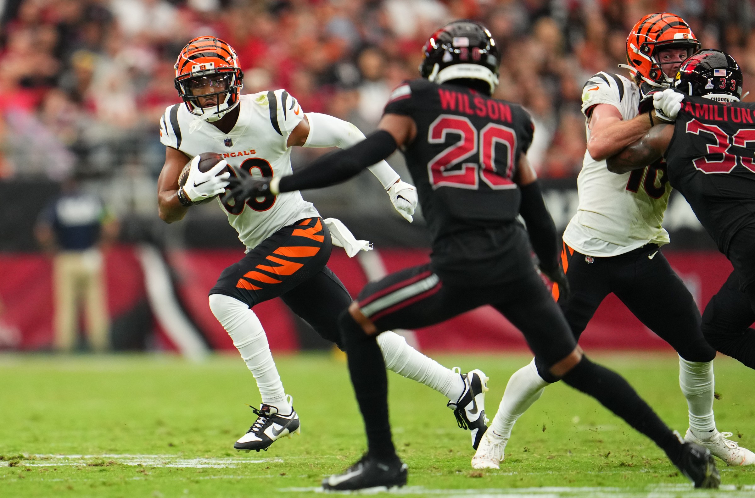 GLENDALE, AZ - OCTOBER 08: Tyler Boyd #83 of the Cincinnati Bengals runs with the ball against the Arizona Cardinals during the second half at State Farm Stadium on October 8, 2023 in Glendale, Arizona. (Photo by Cooper Neill/Getty Images)