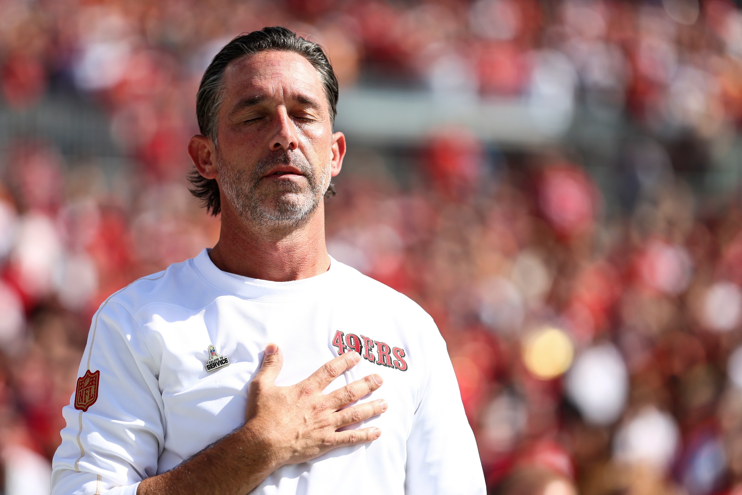 TAMPA, FLORIDA - NOVEMBER 10: Head coach Kyle Shanahan of the San Francisco 49ers stands on the sidelines during the national anthem prior to an NFL football game against the Tampa Bay Buccaneers at Raymond James Stadium on November 10, 2024 in Tampa, Florida. (Photo by Kevin Sabitus/Getty Images)