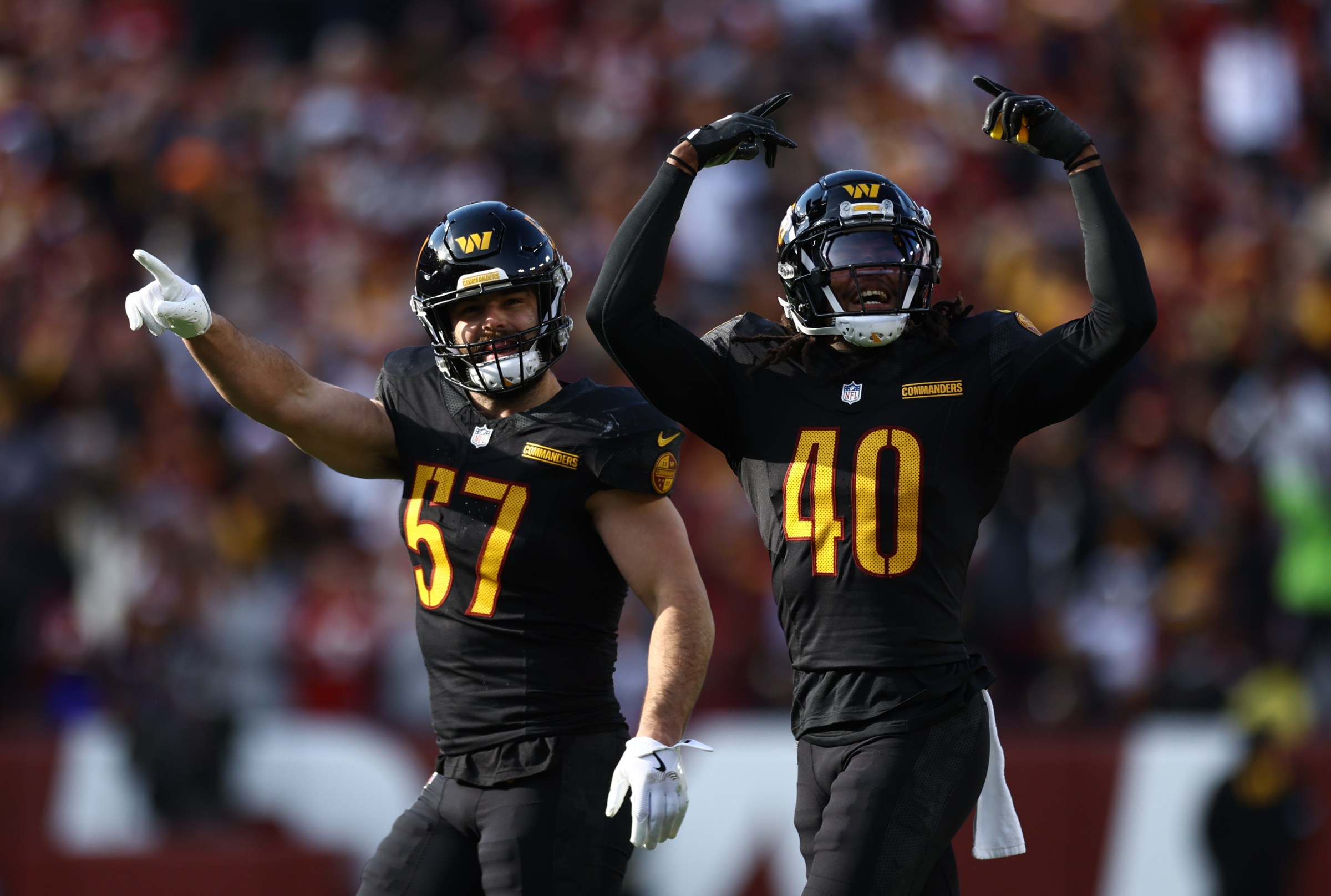LANDOVER, MARYLAND - DECEMBER 01: Nick Bellore #57 and Tyler Owens #40 of the Washington Commanders react following a fumble by the Tennessee Titans at Northwest Stadium on December 01, 2024 in Landover, Maryland. (Photo by Timothy Nwachukwu/Getty Images)