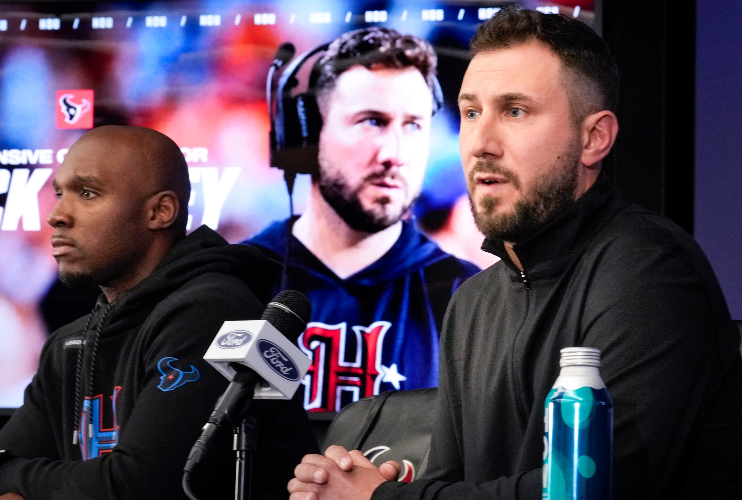 HOUSTON, TEXAS - FEBRUARY 13: Houston Texans offensive coordinator Nick Caley and head coach DeMeco Ryans, left, speaks to the media during a news conference introducing the new assistant coach on Thursday, Feb. 13, 2025, in Houston. (Brett Coomer/Houston Chronicle via Getty Images)