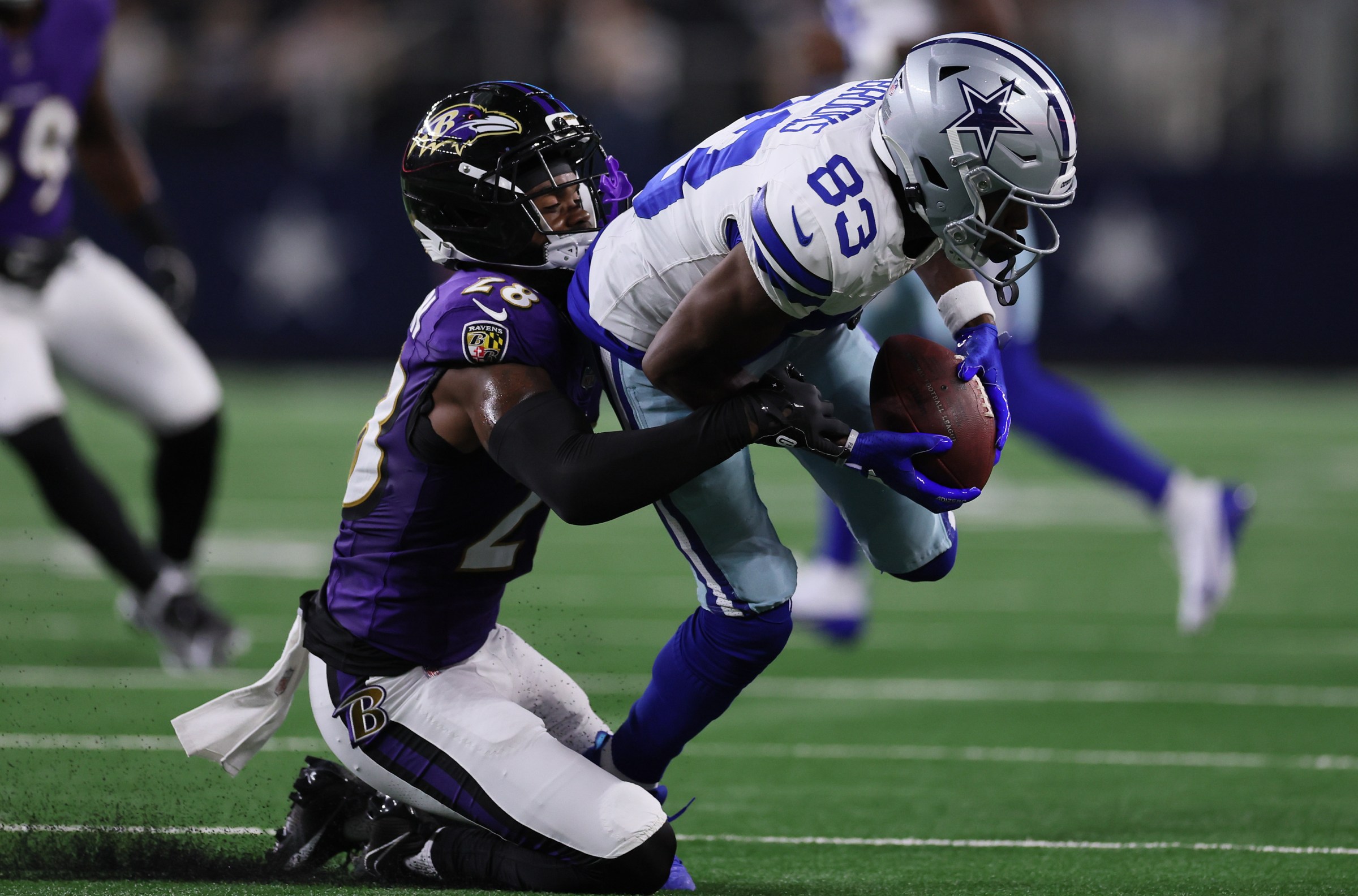 ARLINGTON, TEXAS - AUGUST 16: Jalen Brooks #83 of the Dallas Cowboys catches a pass as Marquise Robinson #28 of the Baltimore Ravens defends during the second half of the NFL Preseason 2025 game at AT&T Stadium on August 16, 2025 in Arlington, Texas. (Photo by Sam Hodde/Getty Images)