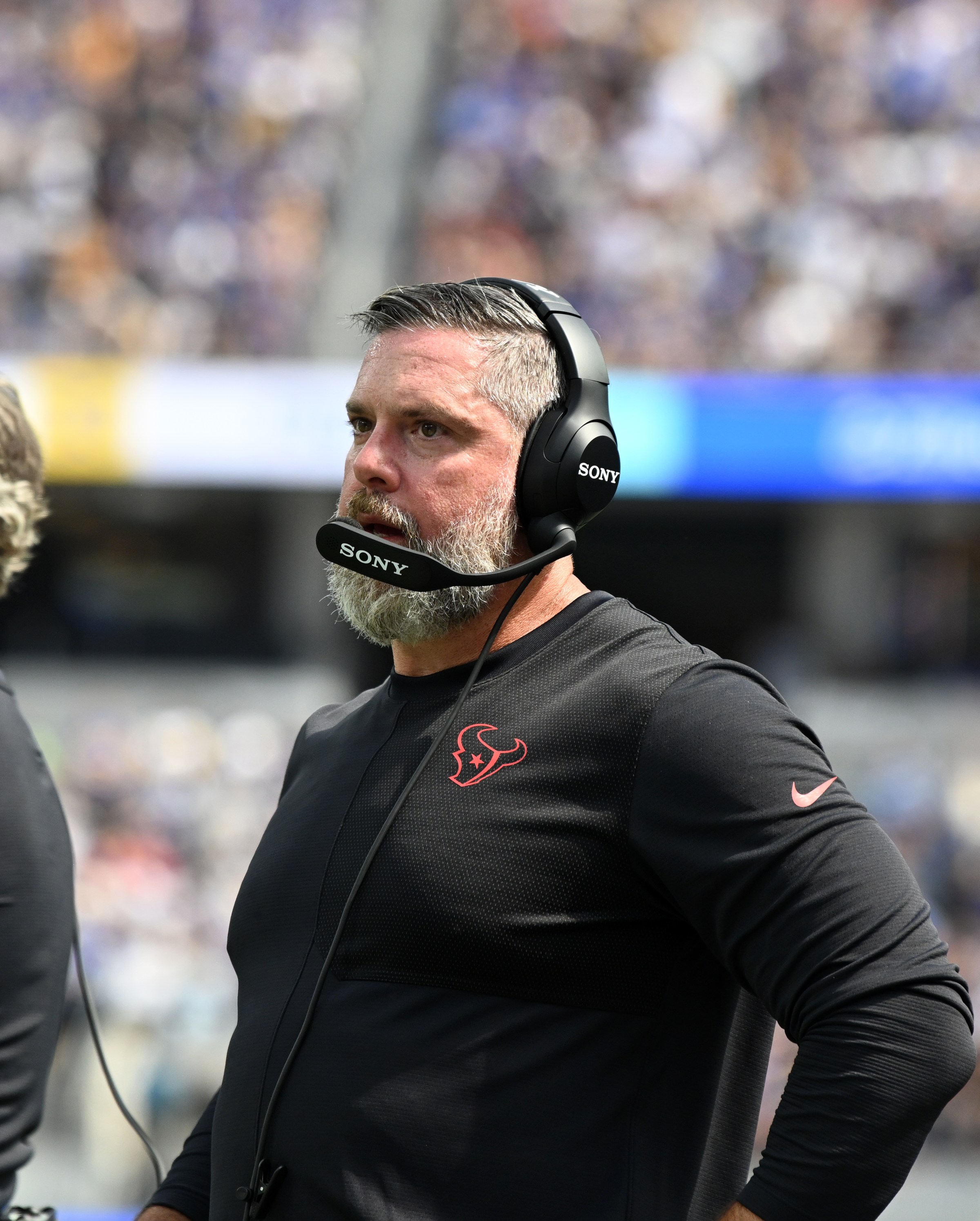 INGLEWOOD, CA - SEPTEMBER 07: Houston Texans assistant coach Matt Burke watches action during game featuring the Houston Texans and the Los Angeles Rams on September 7, 2025 at SoFi Stadium in Inglewood, CA. (Photo by John Rivera/Icon Sportswire via Getty Images)
