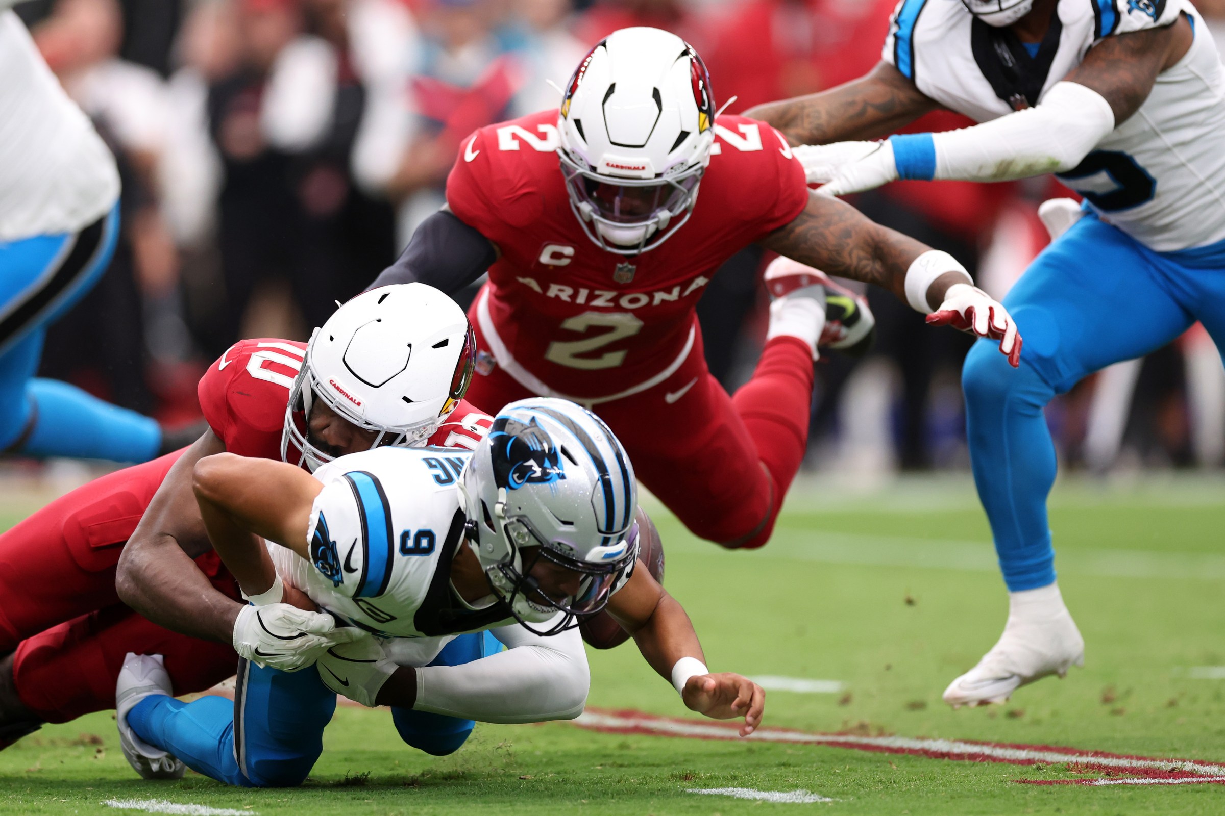 GLENDALE, ARIZONA - SEPTEMBER 14: Linebacker Josh Sweat #10 of the Arizona Cardinals strip sacks quarterback Bryce Young #9 of the Carolina Panthers during the first quarter at State Farm Stadium on September 14, 2025 in Glendale, Arizona. The Cardinals defeated the Panthers 27-22. (Photo by Chris Coduto/Getty Images)