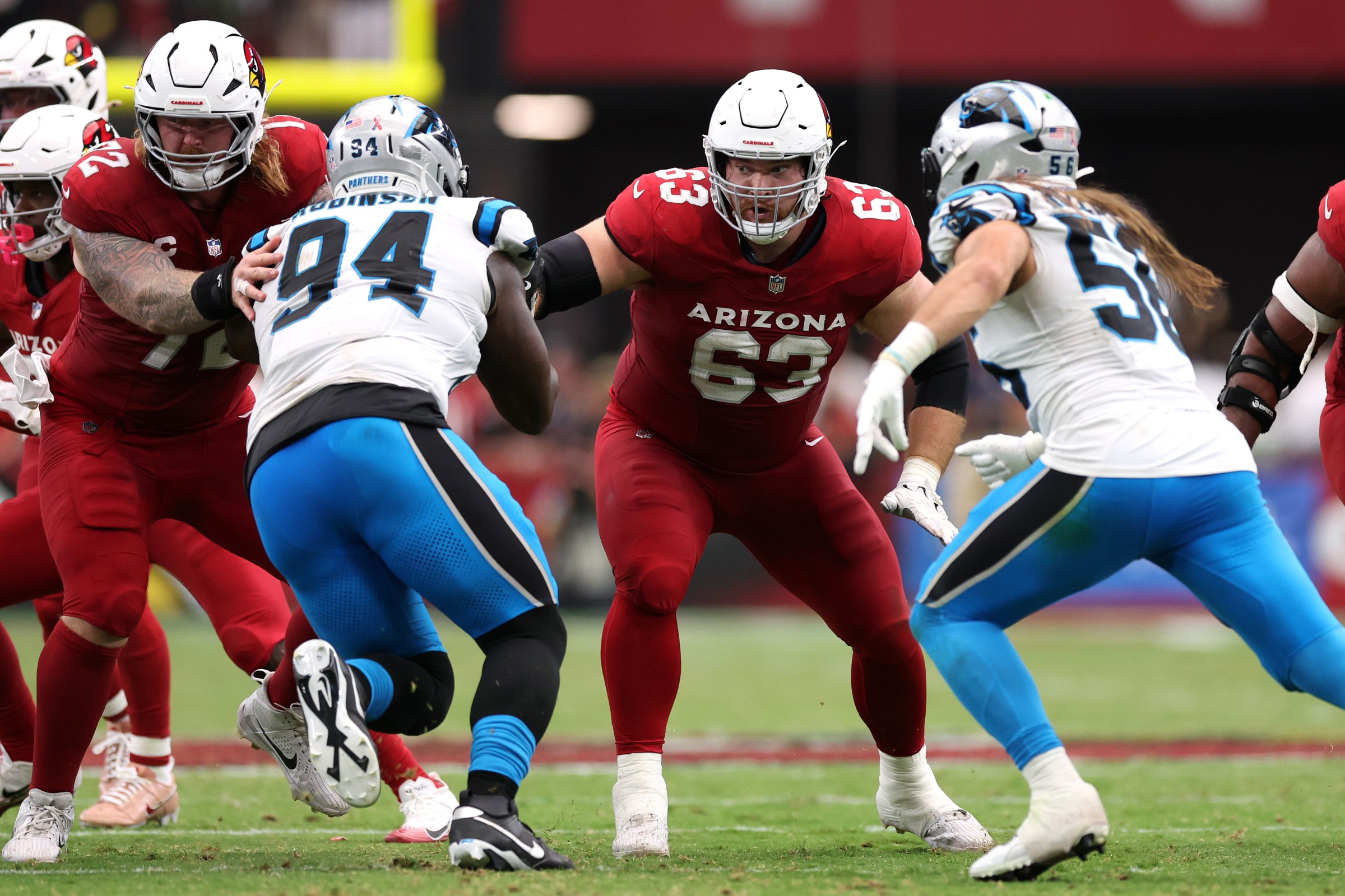GLENDALE, ARIZONA - SEPTEMBER 14: Center Evan Brown #63 and guard Hjalte Froholdt #72 of the Arizona Cardinals block defensive end A’Shawn Robinson #94 of the Carolina Panthers during the second quarter at State Farm Stadium on September 14, 2025 in Glendale, Arizona. The Cardinals defeated the Panthers 27-22. (Photo by Chris Coduto/Getty Images)