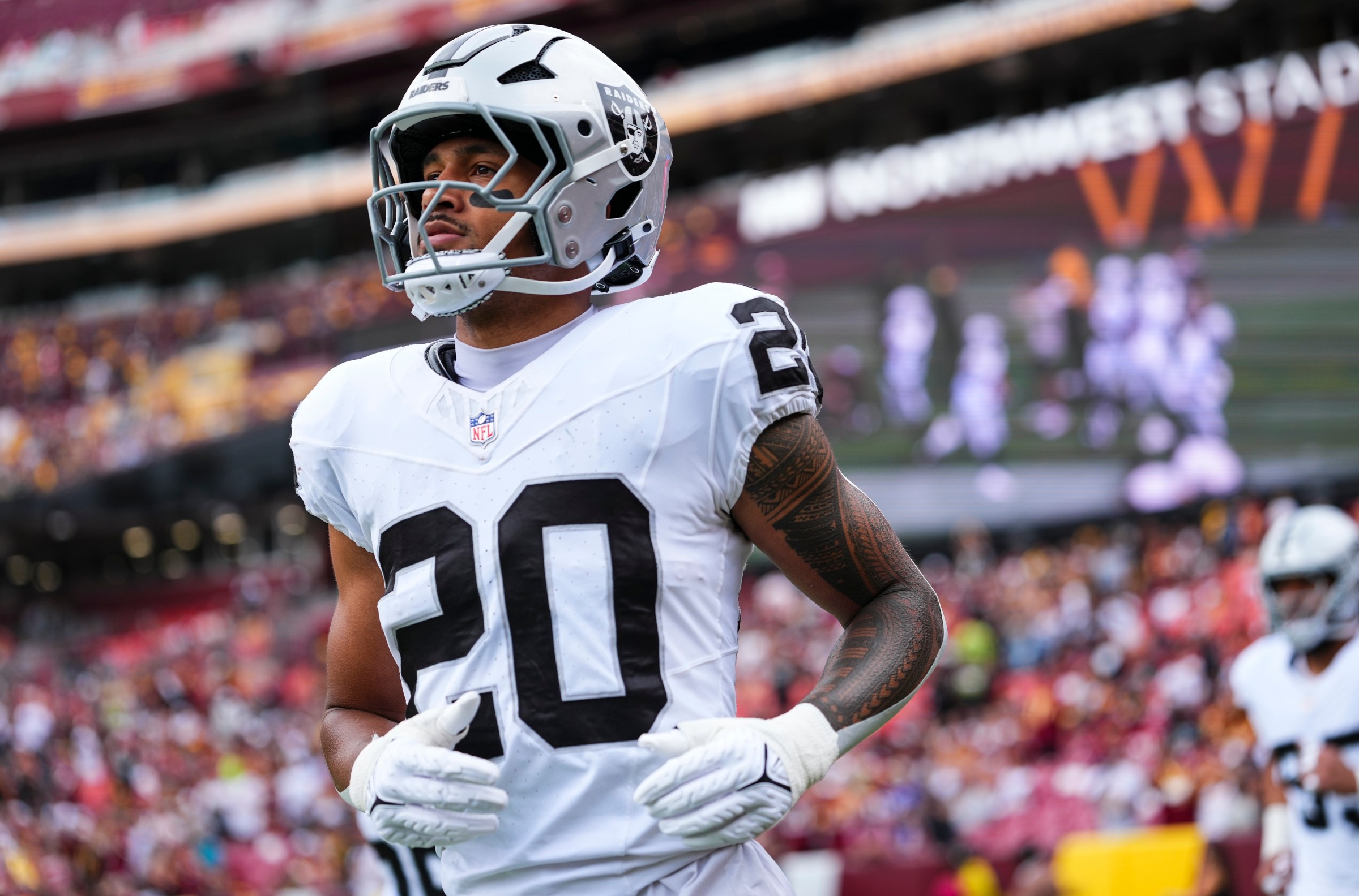LANDOVER, MD - SEPTEMBER 21: Isaiah PolaMao #20 of the Las Vegas Raiders runs out of the tunnel prior to an NFL football game against the Washington Commanders at Northwest Stadium on September 21, 2025 in Landover, Maryland. (Photo by Cooper Neill/Getty Images)