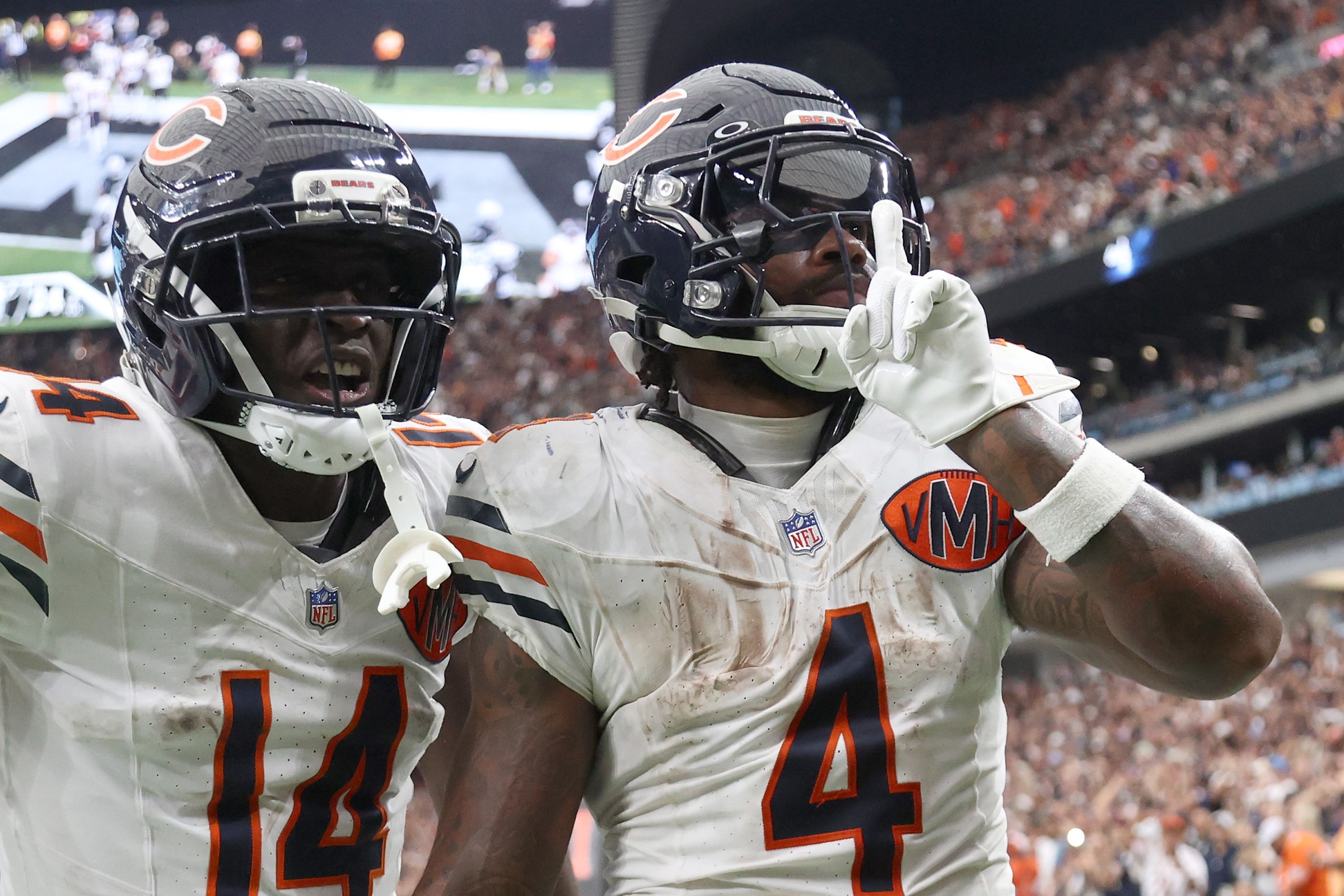 LAS VEGAS, NEVADA - SEPTEMBER 28: D’Andre Swift #4 celebrates a fourth quarter touchdown against the Las Vegas Raiders with Olamide Zaccheaus #14 of the Chicago Bears at Allegiant Stadium on September 28, 2025 in Las Vegas, Nevada. (Photo by Ian Maule/Getty Images)