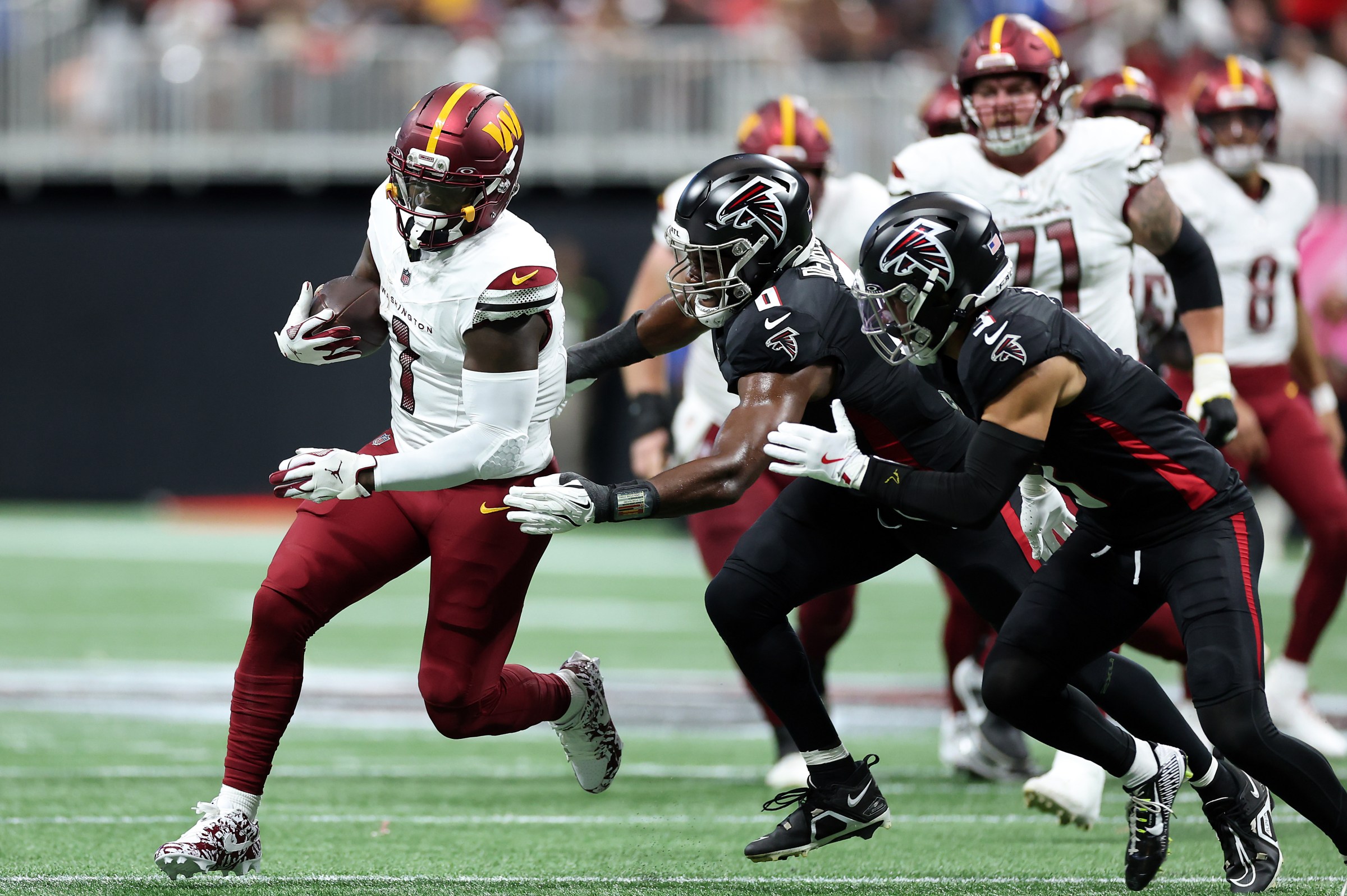 ATLANTA, GEORGIA - SEPTEMBER 28: Wide receiver Deebo Samuel Sr. #1 of the Washington Commanders carries the ball during the game against the Atlanta Falcons at Mercedes-Benz Stadium on September 28, 2025 in Atlanta, Georgia. (Photo by Kevin C. Cox/Getty Images)