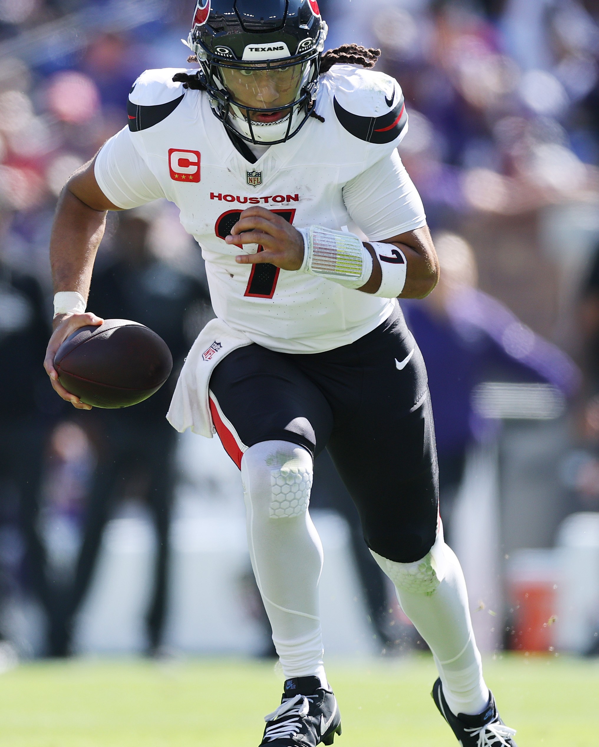 BALTIMORE, MARYLAND - OCTOBER 05: C.J. Stroud #7 of the Houston Texans runs the ball during the second quarter against the Baltimore Ravens in the game at M&T Bank Stadium on October 05, 2025 in Baltimore, Maryland. (Photo by Patrick Smith/Getty Images)