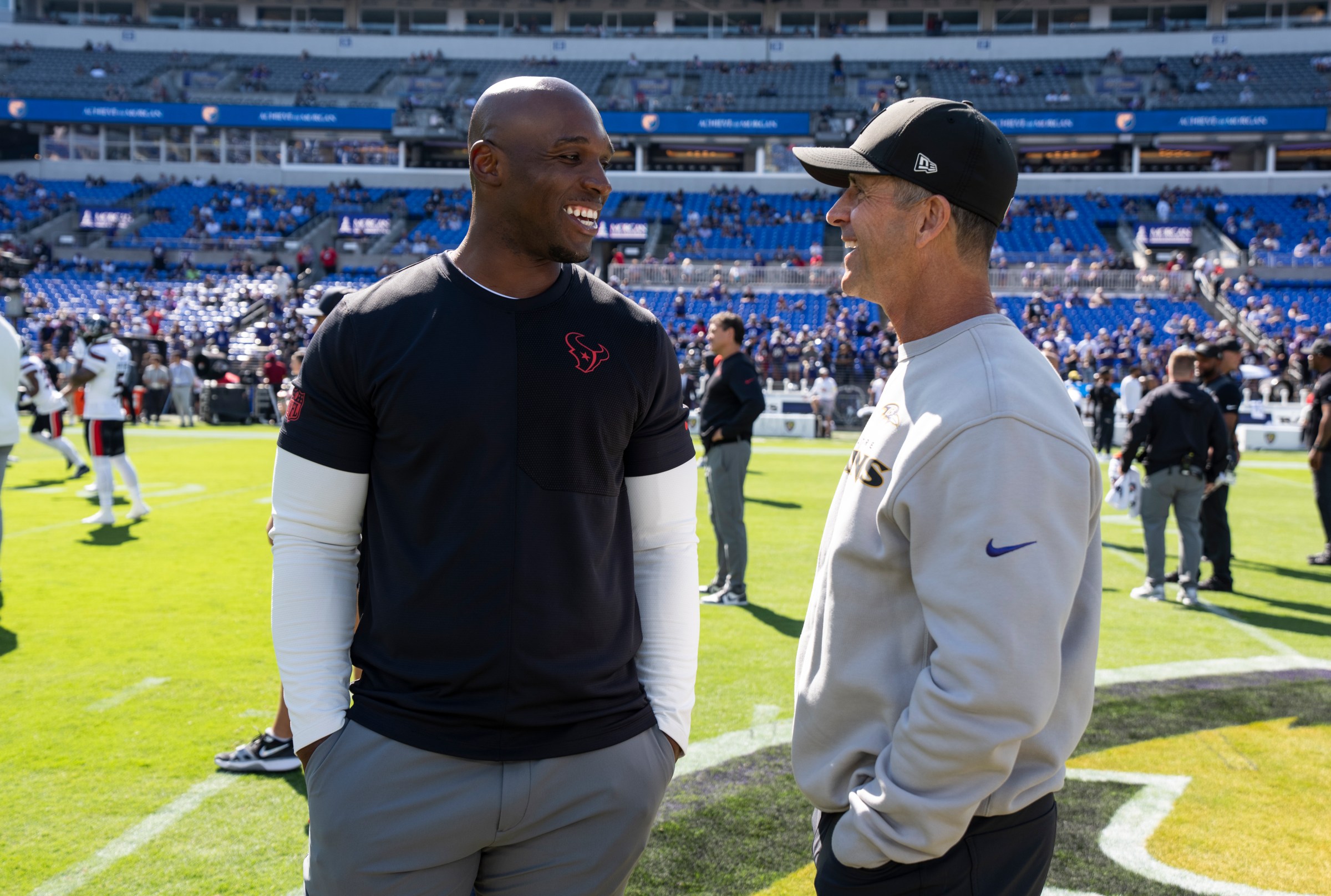 BALTIMORE, MARYLAND - OCTOBER 5: Head coach DeMeco Ryans of the Houston Texans and Head coach John Harbaugh of the Baltimore Ravens share a moment prior to an NFL football game at M&T Bank Stadium on October 05, 2025 in Baltimore, Maryland. (Photo by Michael Owens/Getty Images)