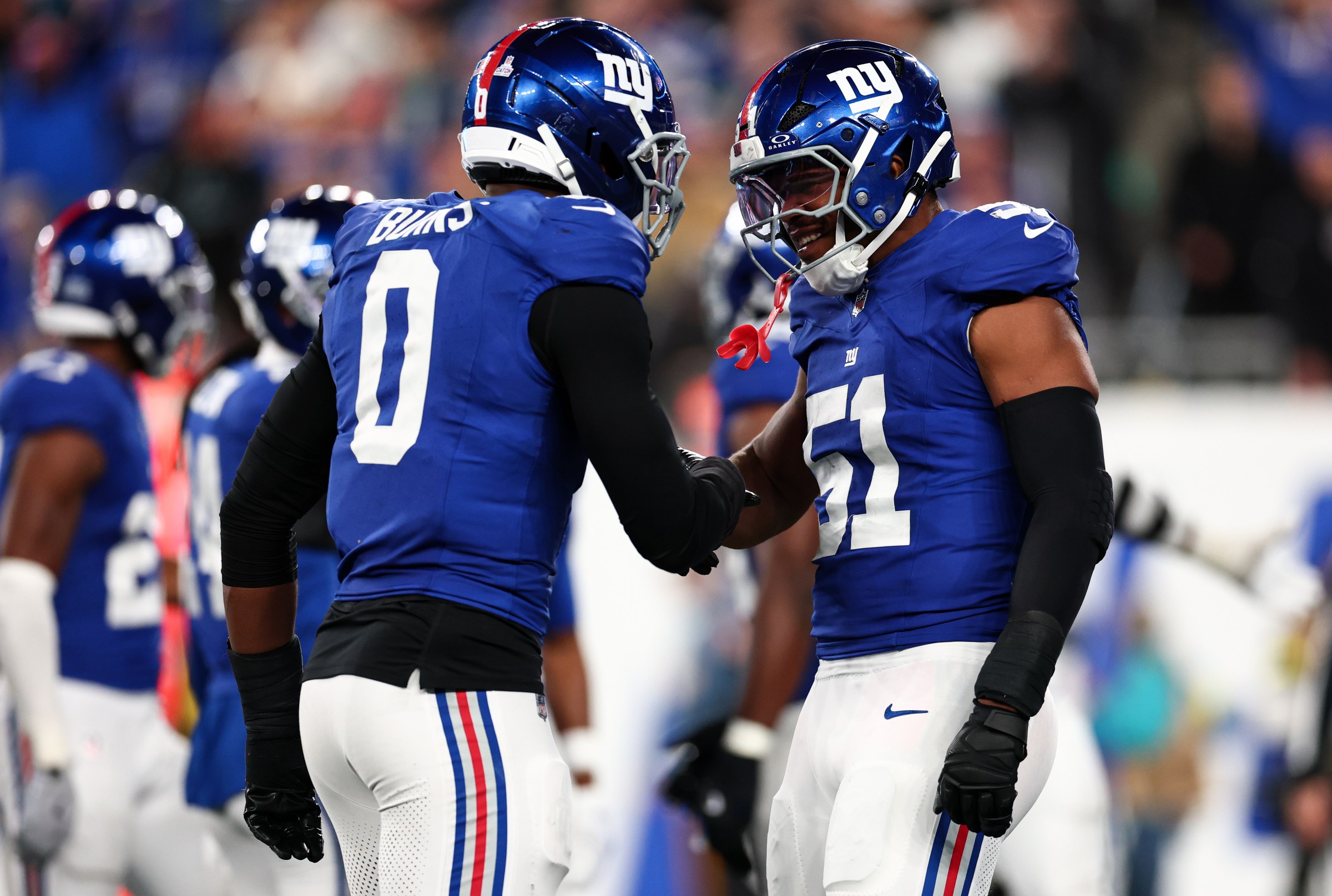 Brian Burns (0) and Abdul Carter