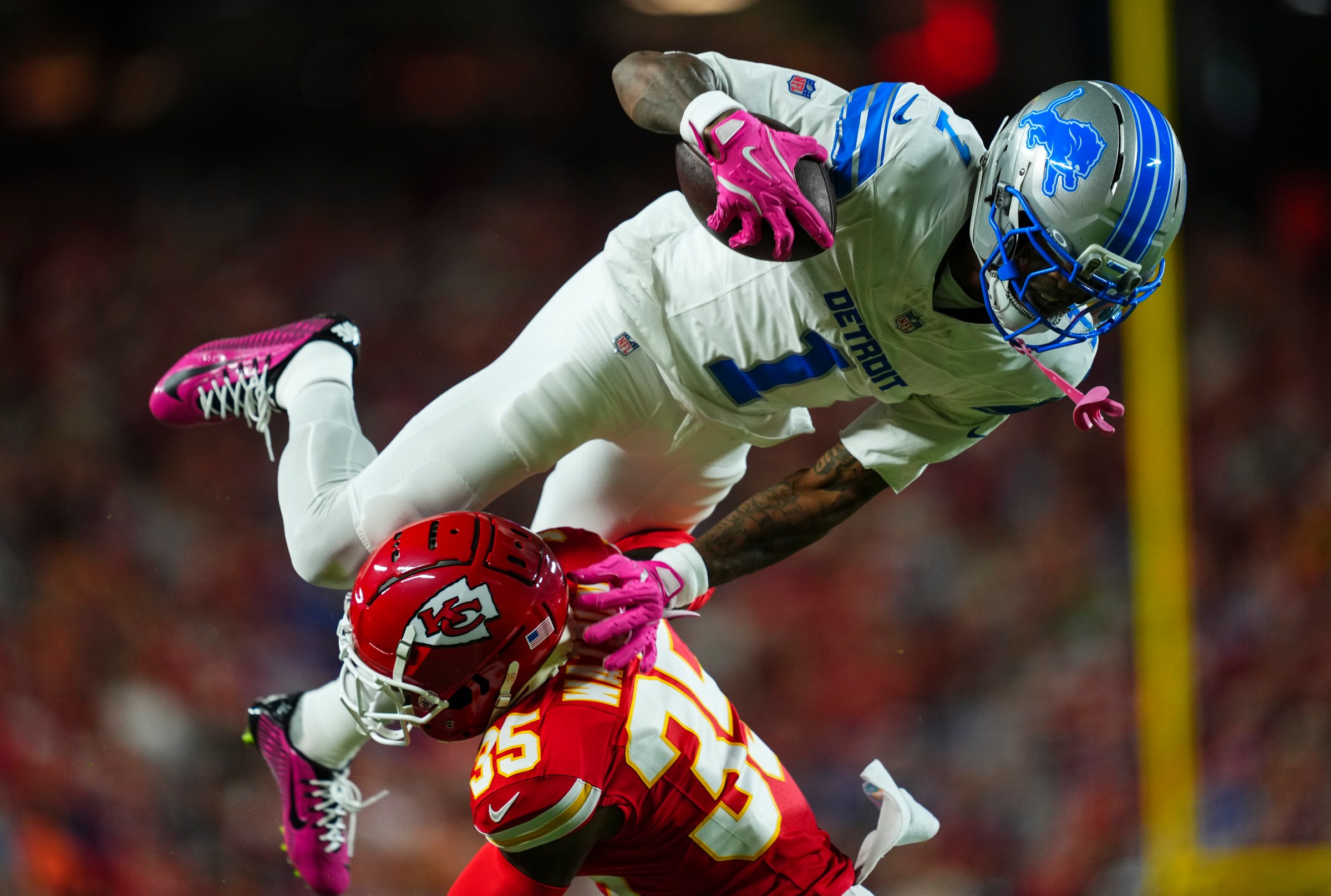 KANSAS CITY, MO - OCTOBER 12: Jameson Williams #1 of the Detroit Lions hurdles with the ball during an NFL football game against the Kansas City Chiefs at GEHA Field at Arrowhead Stadium on October 12, 2025 in Kansas City, Missouri. (Photo by Cooper Neill/Getty Images)