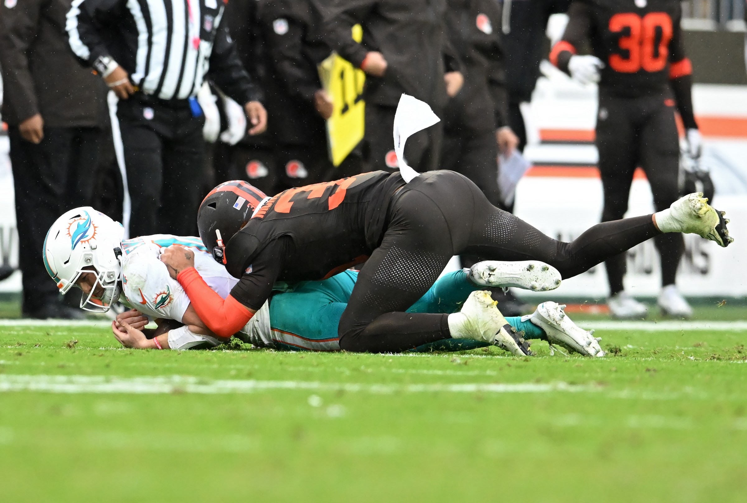 CLEVELAND, OHIO - OCTOBER 19: Donovan McMillon #31 of the Cleveland Browns sacks Quinn Ewers #14 of the Miami Dolphins during the fourth quarter at Huntington Bank Field on October 19, 2025 in Cleveland, Ohio. (Photo by Nick Cammett/Getty Images)