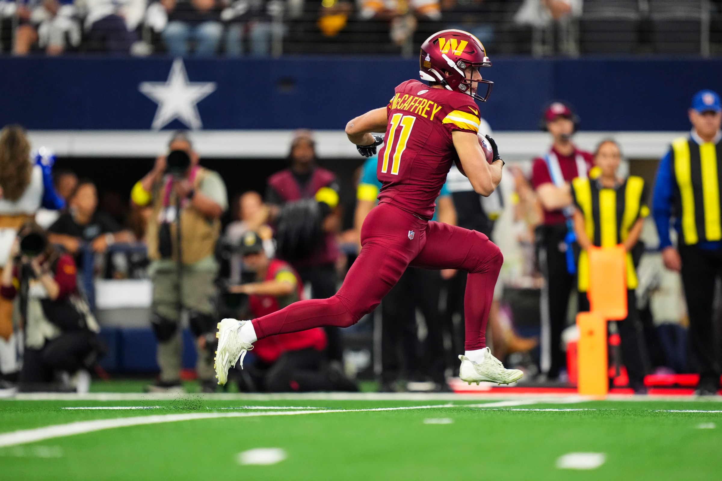 ARLINGTON, TX - OCTOBER 19: Luke McCaffrey #11 of the Washington Commanders runs the ball during an NFL football game against the Dallas Cowboys at AT&T Field on October 19, 2025 in Arlington, Texas. (Photo by Cooper Neill/Getty Images)