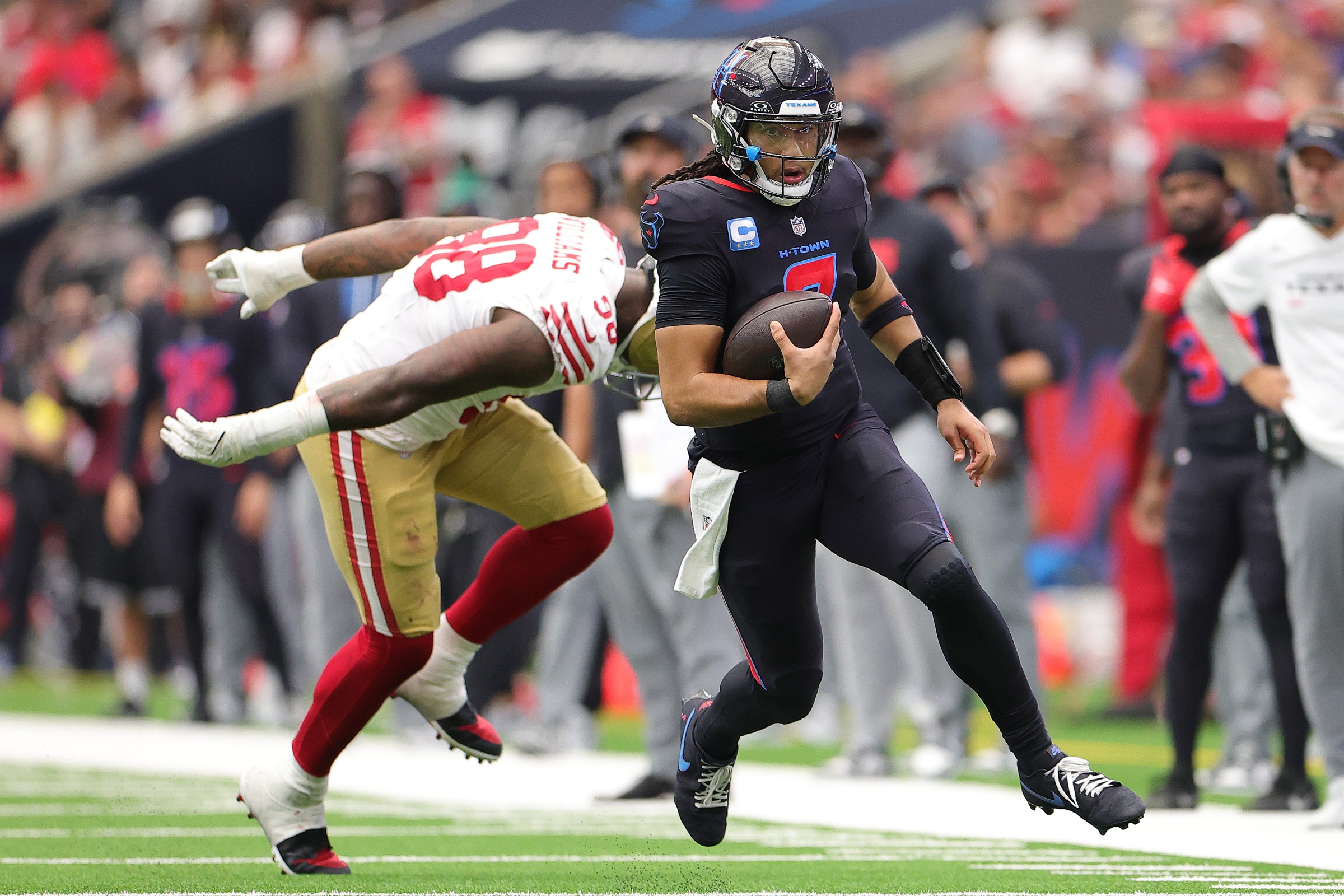HOUSTON, TEXAS - OCTOBER 26: C.J. Stroud #7 of the Houston Texans runs with the ball in the second quarter of the game against the San Francisco 49ers at NRG Stadium on October 26, 2025 in Houston, Texas. (Photo by Alex Slitz/Getty Images)
