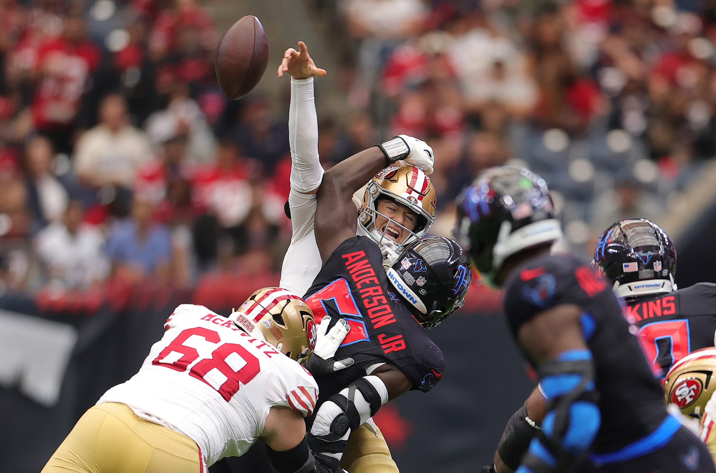 HOUSTON, TEXAS - OCTOBER 26: Will Anderson Jr. #51 of the Houston Texans hits Mac Jones #10 of the San Francisco 49ers in the third quarter of the game at NRG Stadium on October 26, 2025 in Houston, Texas. (Photo by Alex Slitz/Getty Images)