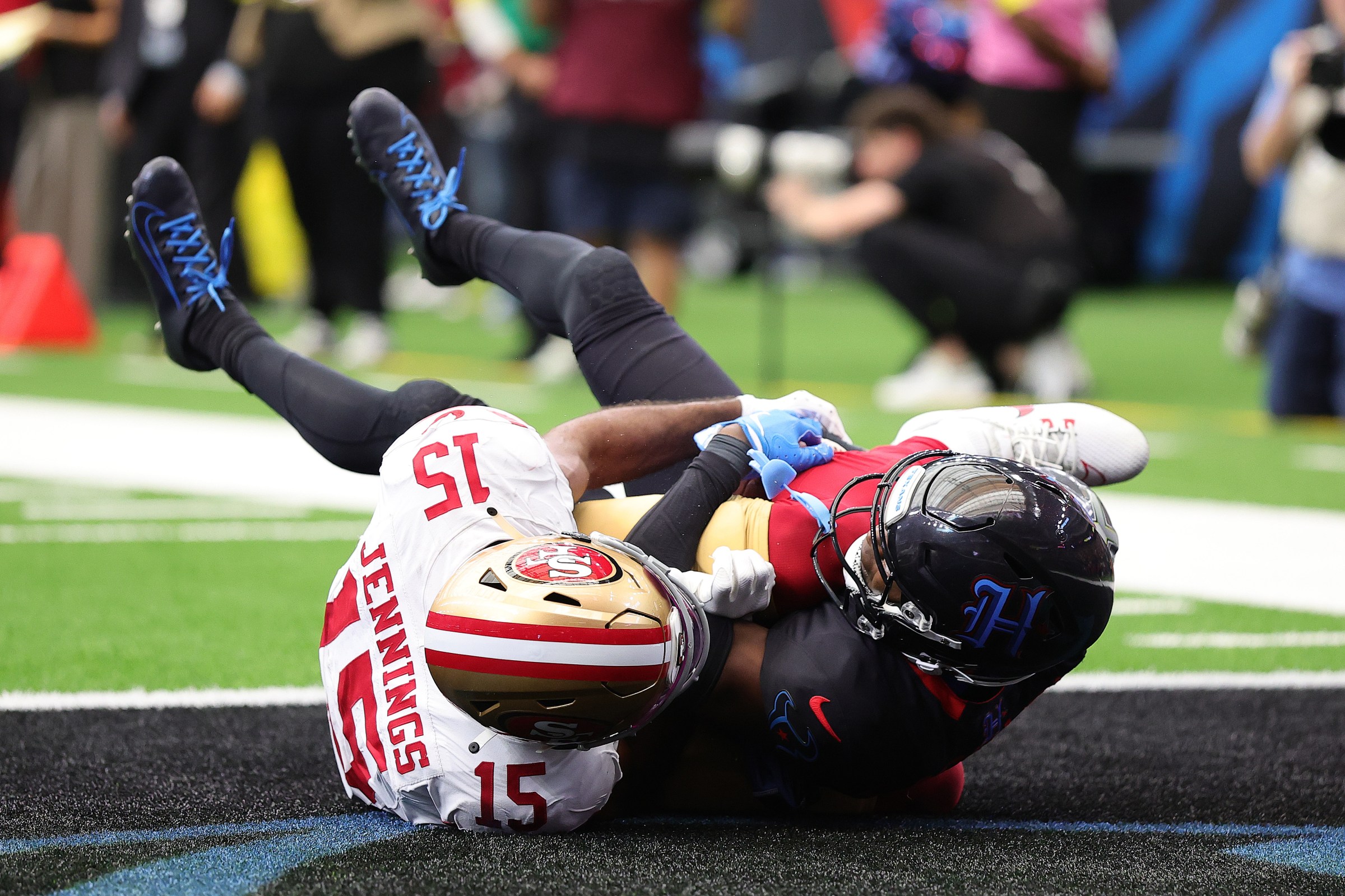HOUSTON, TEXAS - OCTOBER 26: Kamari Lassiter #4 of the Houston Texans catches an interception intended for Jauan Jennings #15 of the San Francisco 49ers during the fourth quarter in the game at NRG Stadium on October 26, 2025 in Houston, Texas. (Photo by Alex Slitz/Getty Images)