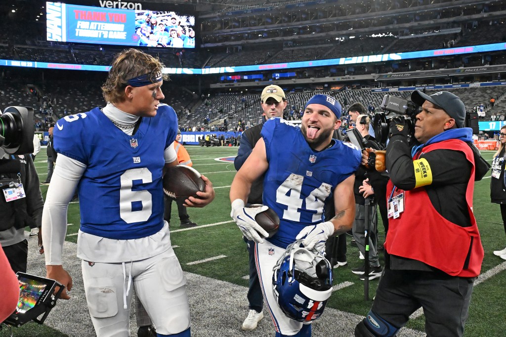 Jaxson Dart (L.) and Cam Skattebo celebrate during the Giants-Eagles game on Oct. 9, 2025. 