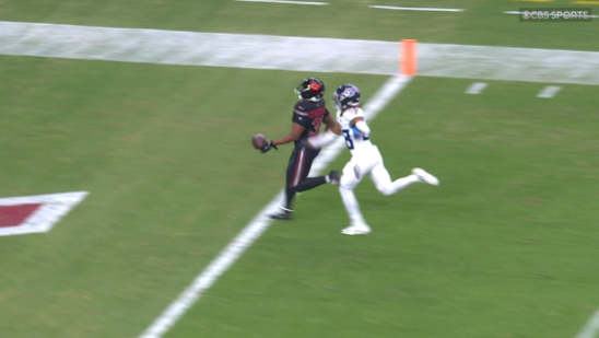 Emari Demercado drops the ball before crossing the goal line against the Titans