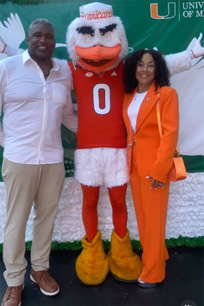 Alonzo Highsmith and his wife Denise Chong Highsmith with the Miami Hurricanes mascot. 