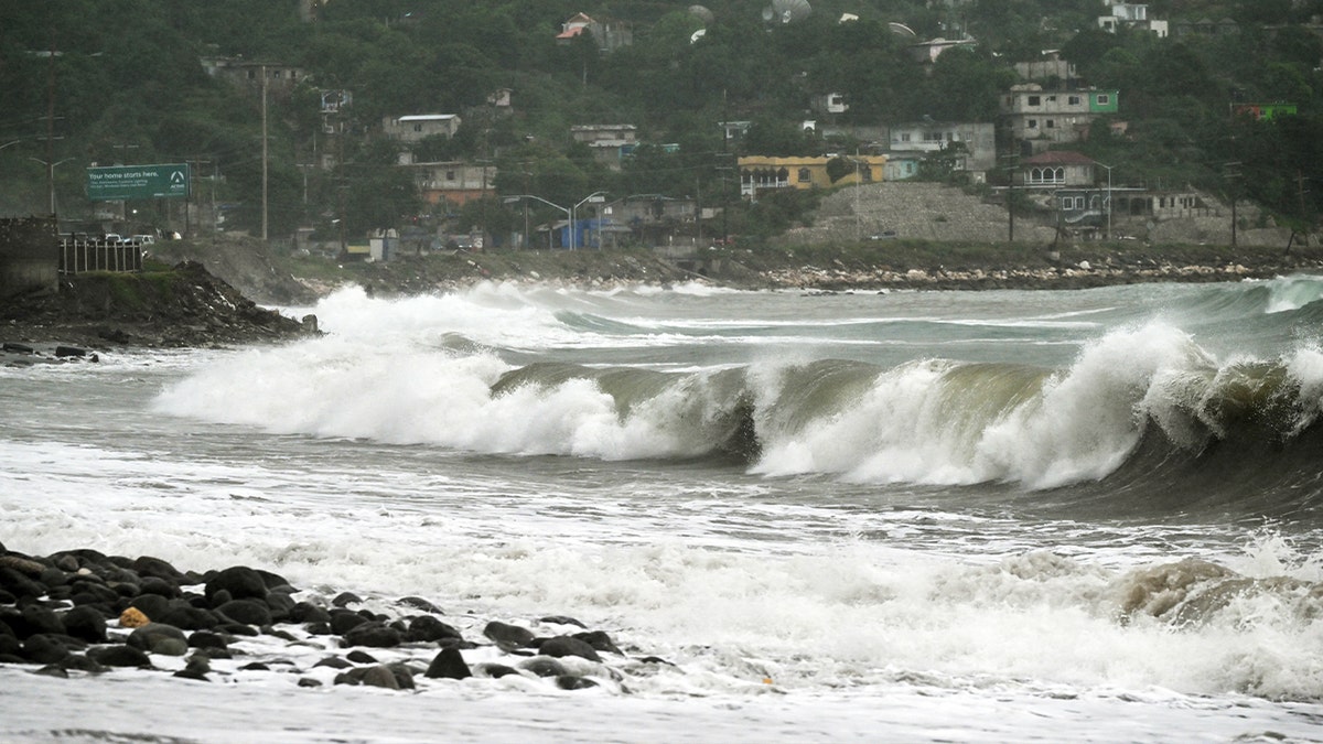 huge waves splash against coast