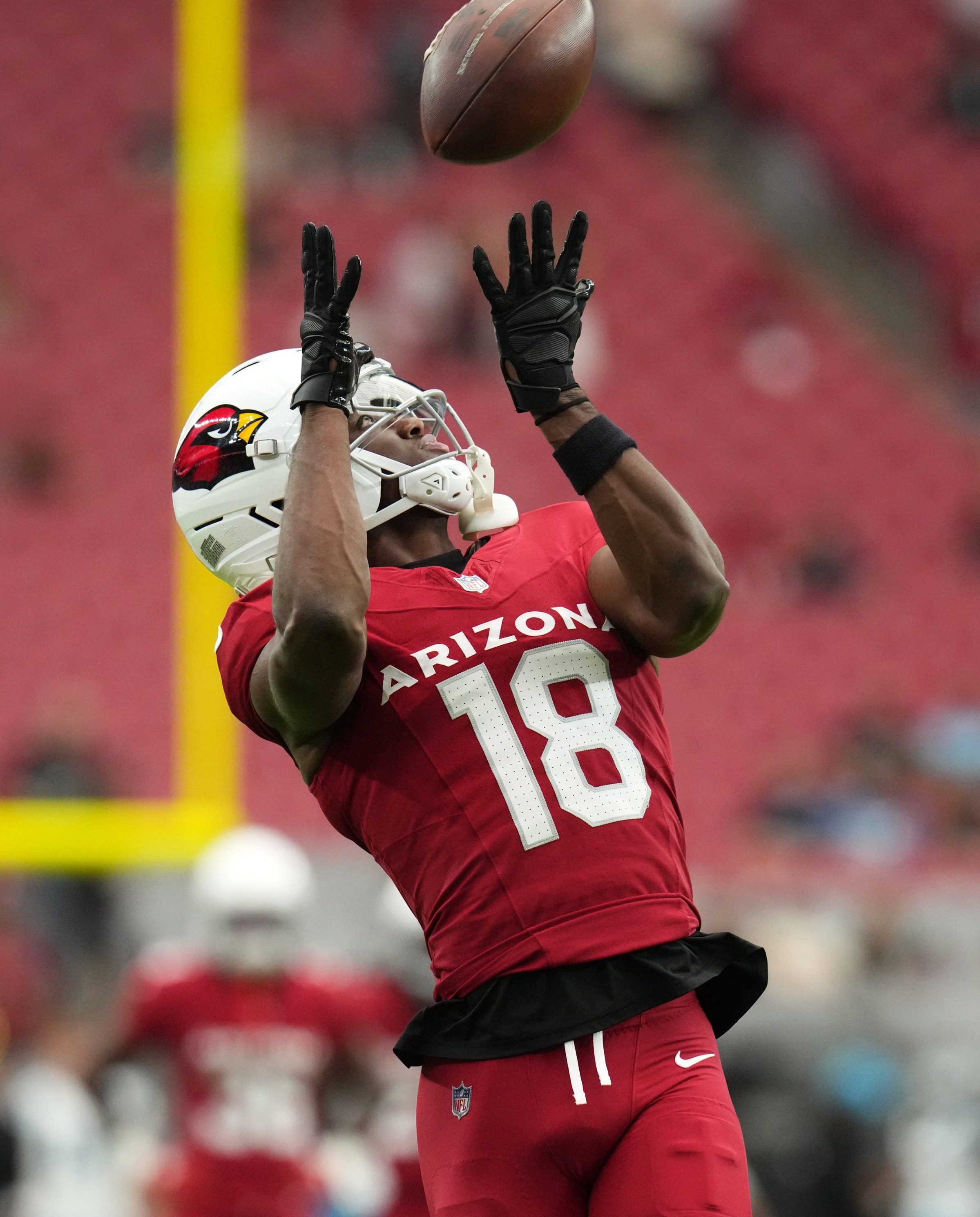 Arizona Cardinals receiver Marvin Harrison Jr. (18) catches a pass during warmups before their game against the Carolina Panthers at State Farm Stadium on Sept. 14, 2025.