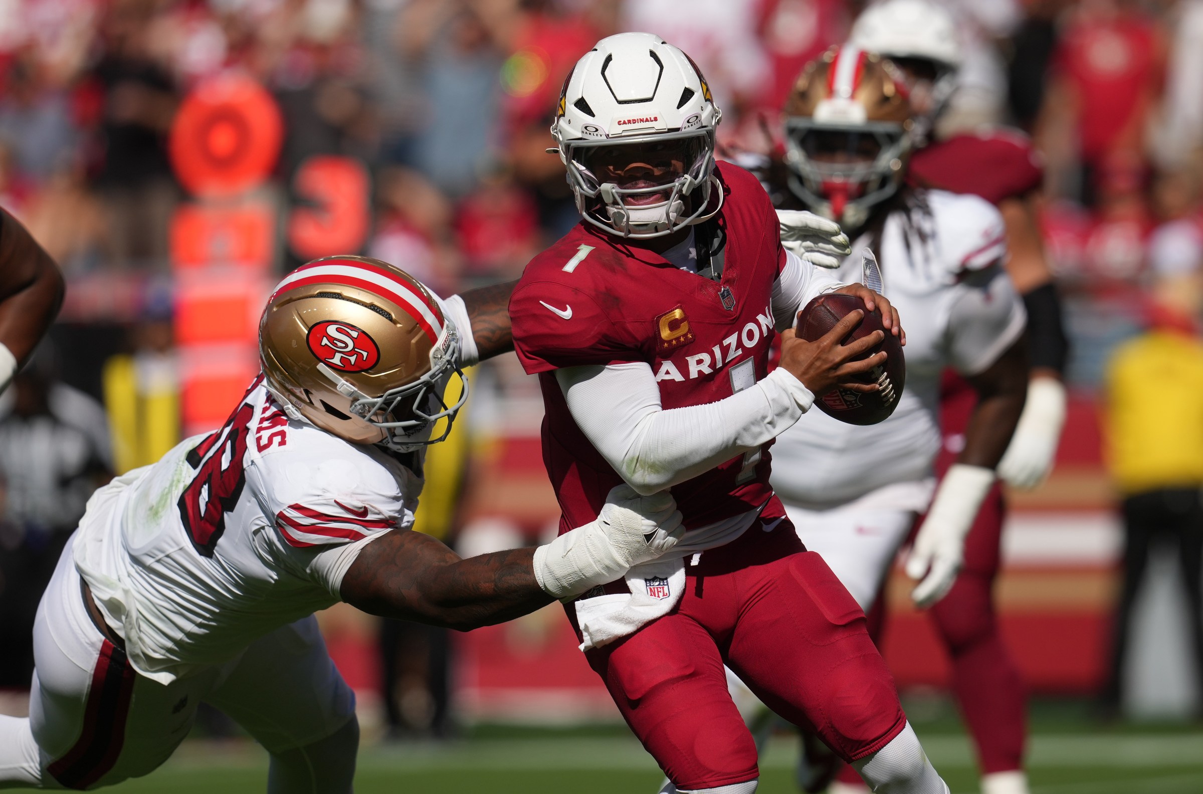 Sep 21, 2025; Santa Clara, California, USA; Arizona Cardinals quarterback Kyler Murray (1) is pressured by San Francisco 49ers defensive end Mykel Williams (98) during the second half at Levi’s Stadium. Mandatory Credit: Cary Edmondson-Imagn Images