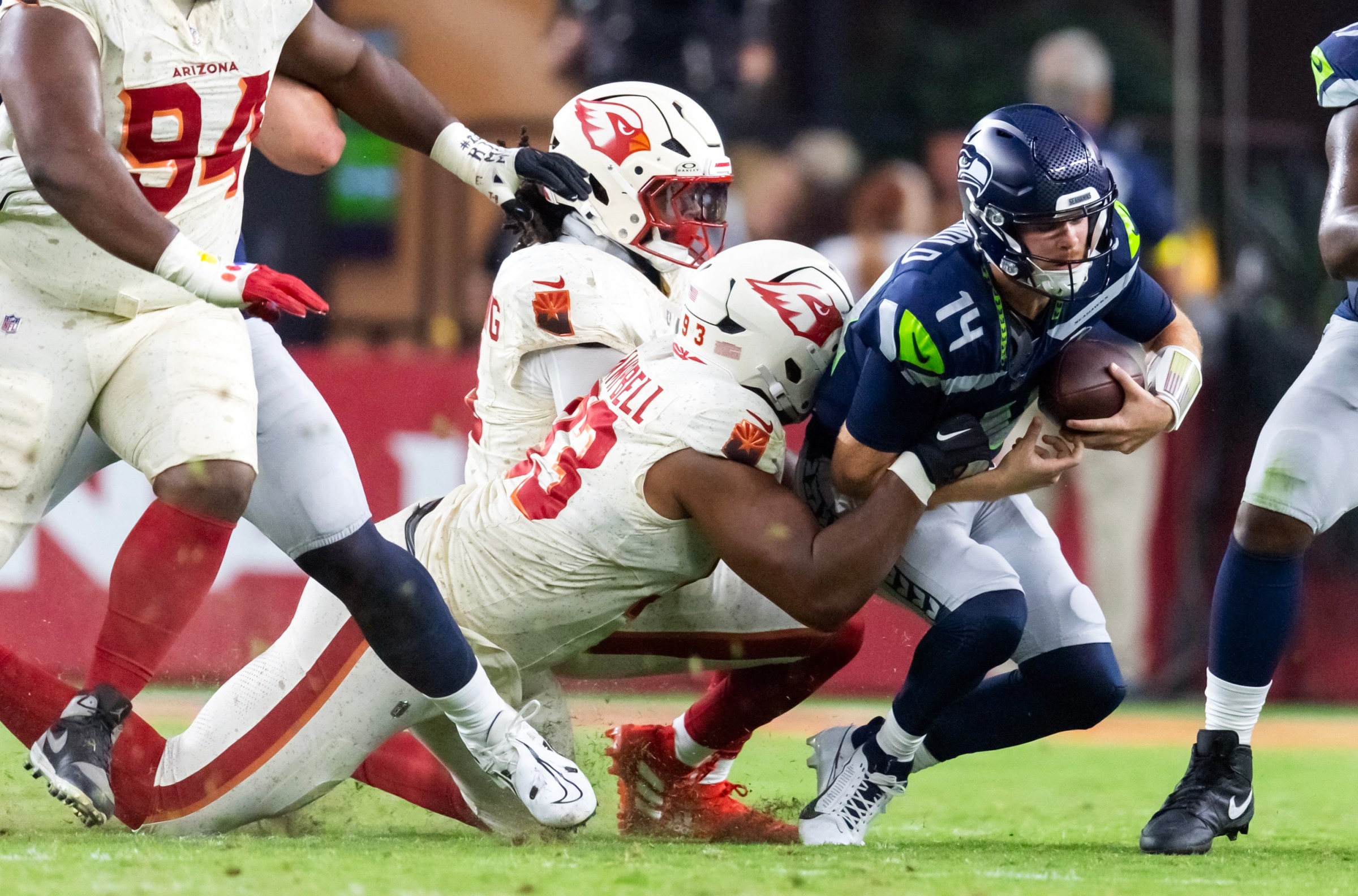 Sep 25, 2025; Glendale, Arizona, USA; Seattle Seahawks quarterback Sam Darnold (14) is sacked by Arizona Cardinals defensive lineman Calais Campbell (93) at State Farm Stadium. Mandatory Credit: Mark J. Rebilas-Imagn Images