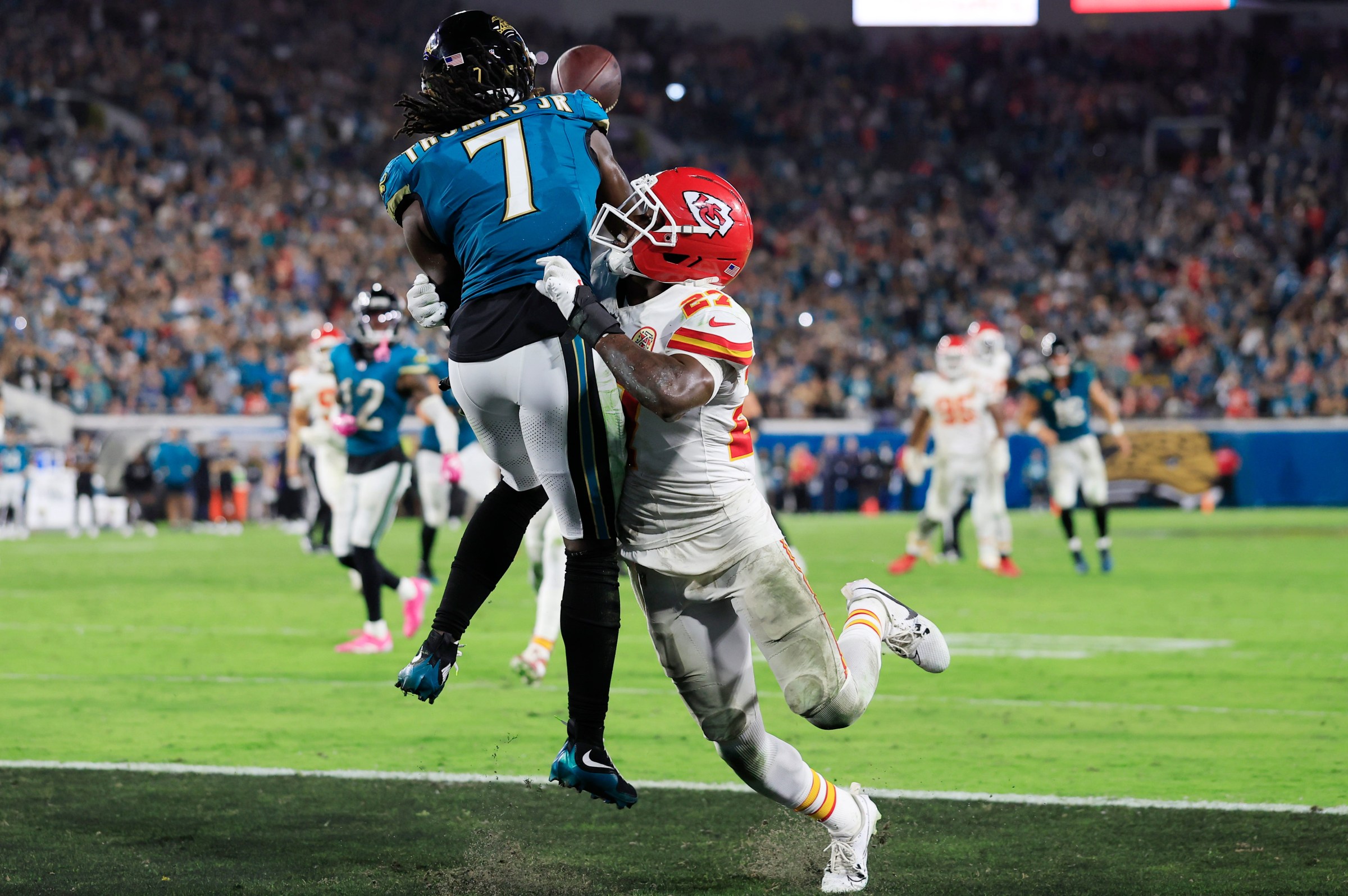Kansas City Chiefs defensive back Chamarri Conner (27), a Trinity Christian Academy (Jacksonville, Fla.) graduate, is called for pass interference on Jacksonville Jaguars wide receiver Brian Thomas Jr. (7) that gave the Jaguars life for a touchdown score a play later from Trevor Lawrence, not shown, during the fourth quarter of an NFL football matchup at EverBank Stadium, Monday, Oct. 6, 2025, in Jacksonville, Fla. The Jacksonville Jaguars edged the Kansas City Chiefs 31-28. [Corey Perrine/Florida Times-Union]