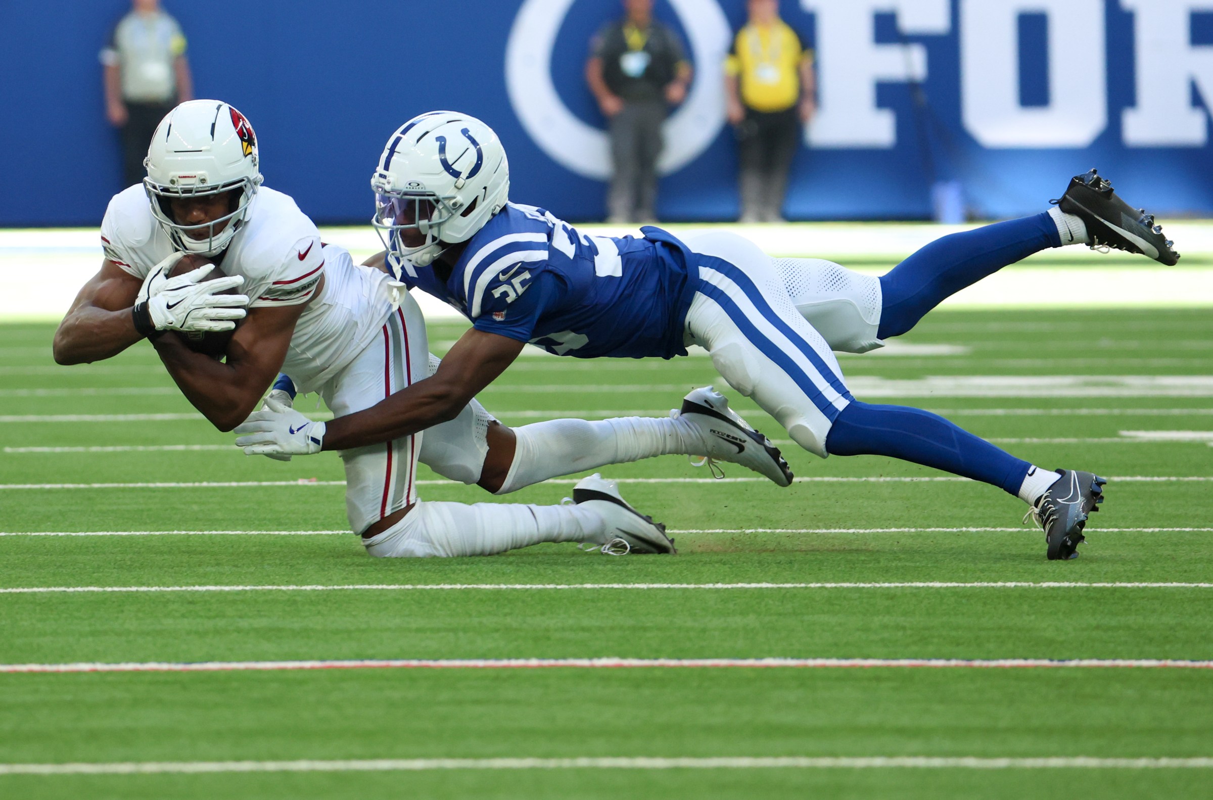 Oct 12, 2025; Indianapolis, Indiana, USA; Arizona Cardinals wide receiver Zay Jones (17) makes a reception defended by Indianapolis Colts cornerback Johnathan Edwards (35) during the second half of the game at Lucas Oil Stadium. Mandatory Credit: Trevor Ruszkowski-Imagn Images