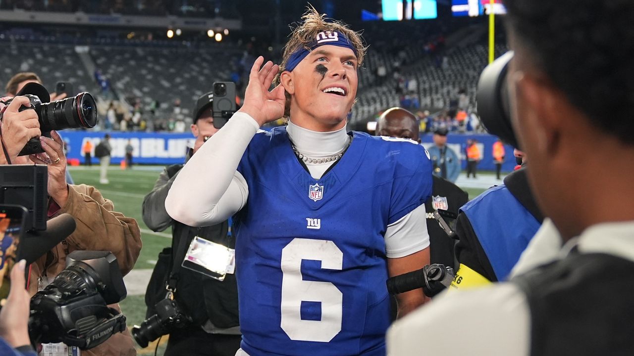 New York Giants' Jaxson Dart reacts after an NFL football game against the Philadelphia Eagles Thursday, Oct. 9, 2025, in East Rutherford, N.J. (AP Photo/Seth Wenig)
