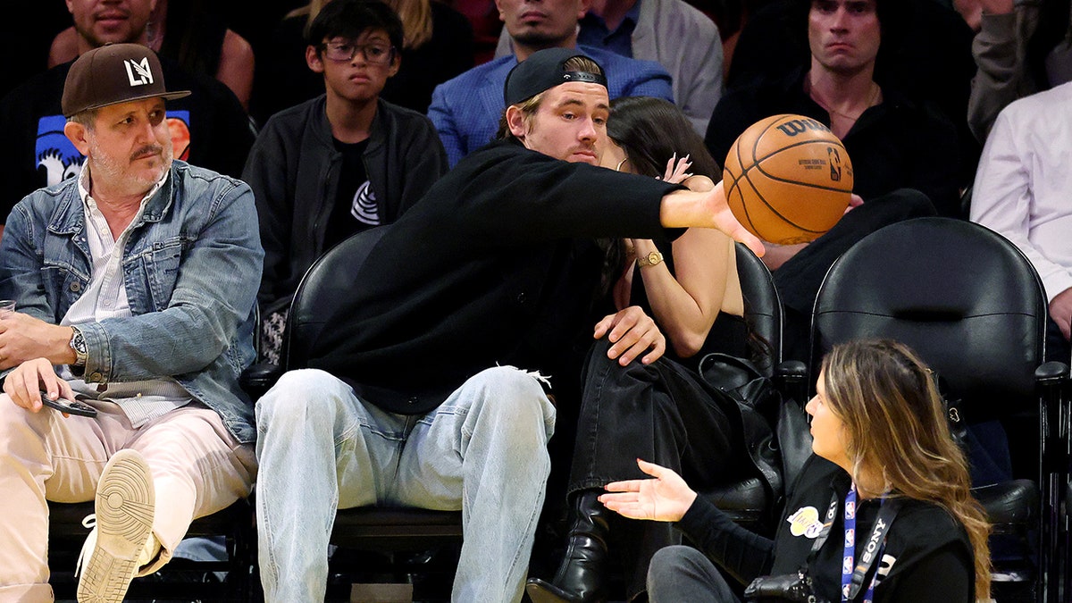 Justin Herbert and Madison Beer courtside at an NBA game