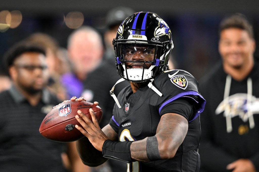 Lamar Jackson #8 of the Baltimore Ravens warms up before the game against the Detroit Lions. Photo by Greg Fiume/Getty Images