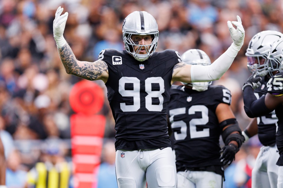 Maxx Crosby #98 of the Las Vegas Raiders pumps up the crowd during the first half of an NFL football game against the Tennessee Titans