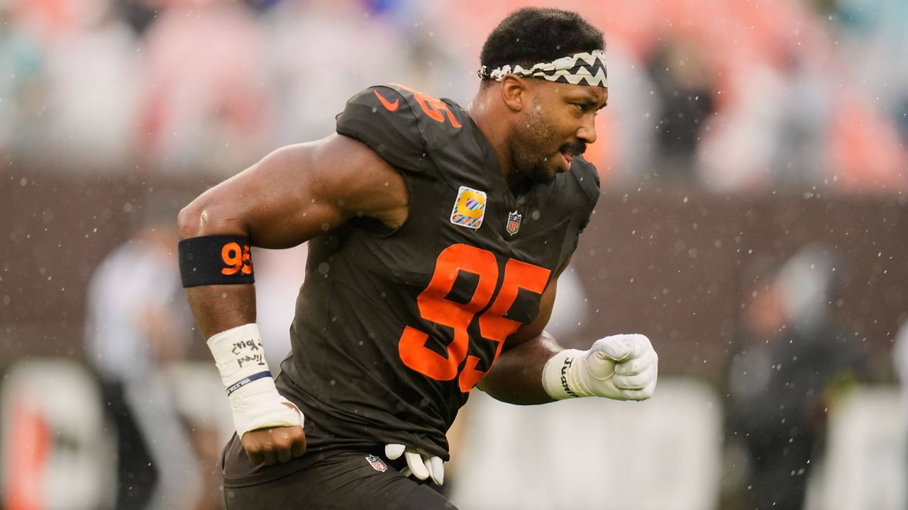 Cleveland Browns defensive end Myles Garrett (95) runs off the field after warm ups before an NFL football game against the Miami Dolphins in Cleveland, Sunday, Oct. 19, 2025. (AP Photo/Sue Ogrocki)