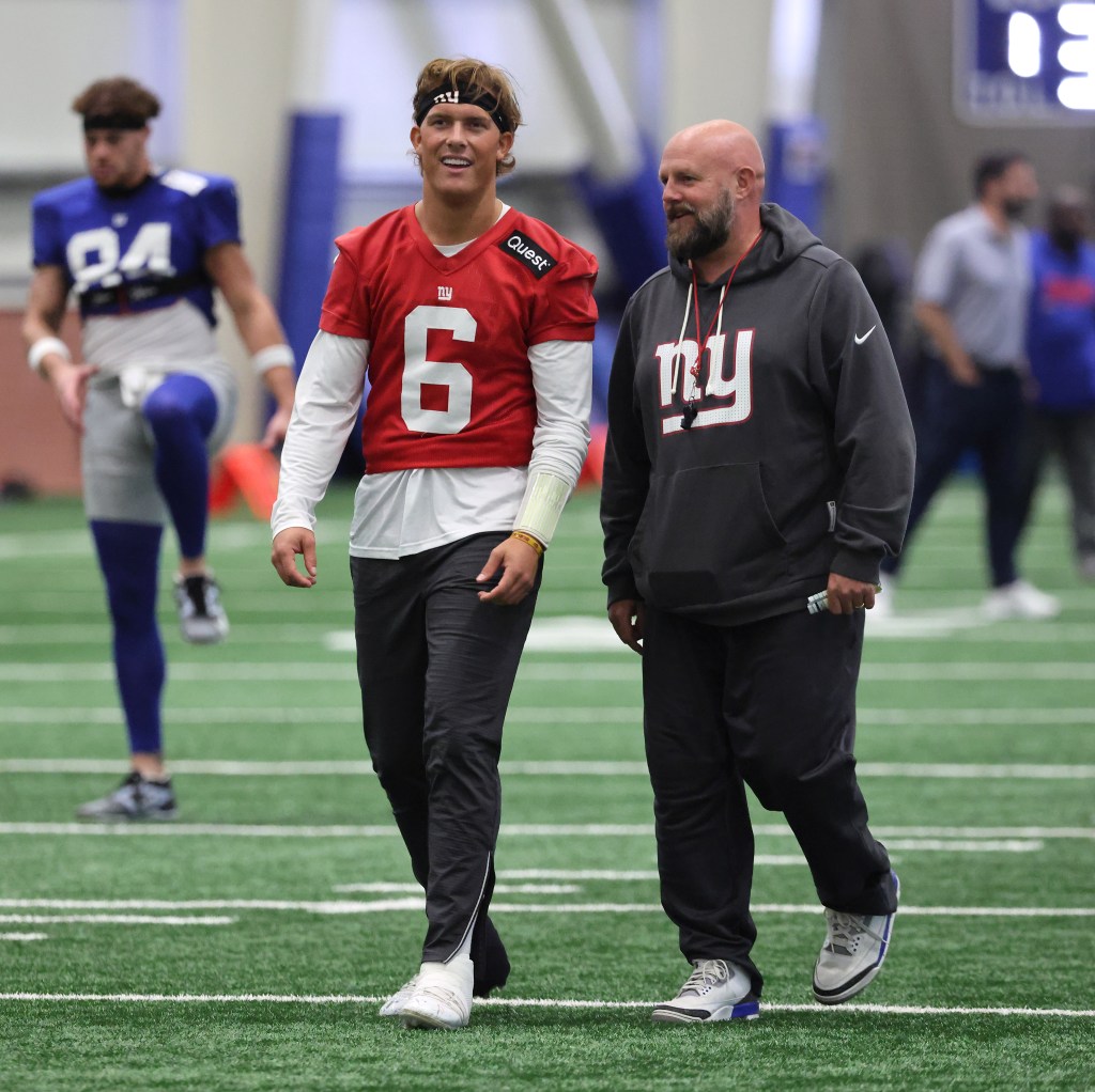 Brian Daboll with New York Giants quarterback Jaxson Dart #6, during practice at the New York Giants training facility in East Rutherford, New Jersey.