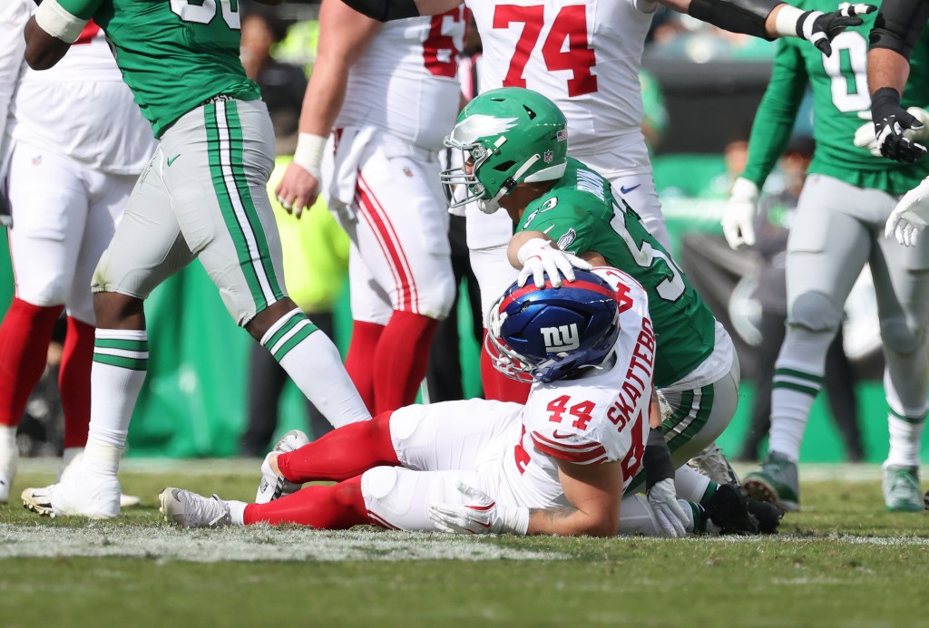New York Giants running back Cam Skattebo #44 is tackled by Philadelphia Eagles linebacker Zack Baun #53 and twists his ankle.