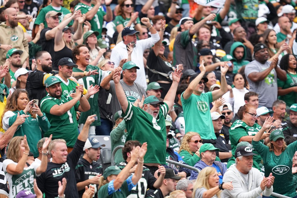 New York Jets fans reacting from the stands of MetLife Stadium.
