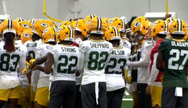 Packers in a hudle at practice