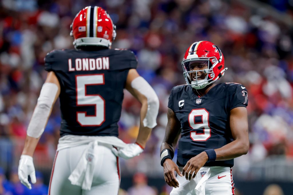 Atlanta Falcons quarterback Michael Penix Jr. (R) reacts with Atlanta Falcons wide receiver Drake London (L) during the first half of a NFL American football game between the Buffalo Bills and the Atlanta Falcons in Atlanta, Georgia, USA, 13 October 2025.